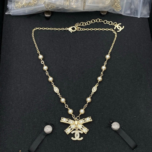 18K  Chanel Bow Tie Diamond Gold Necklace